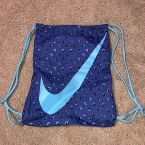 Blue Nike drawstring backpack